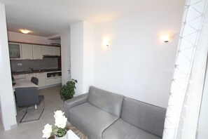 Apartment, 2 Bedrooms | Living area | 1-inch flat-screen TV with satellite channels, TV