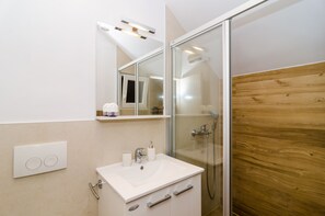 Standard Apartment, 2 Bedrooms, Terrace | Bathroom | Shower, hair dryer, towels - Apartments Petra (Dubrovnik)