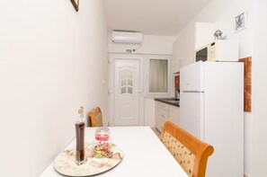 Standard Apartment, 1 Bedroom, Balcony, Sea View | Living area | Flat-screen TV