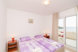 Apartamento standard, 1 quarto, sacada, vista para o mar | 1 quarto, Wi-Fi de cortesia, roupa de cama