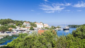 A coastal town with buildings, a marina, and boats.