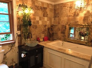 Jetted bath, bidet, towels, soap