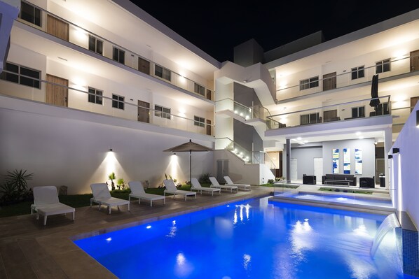 Outdoor pool, open 8:00 AM to 8:00 PM, pool umbrellas, sun loungers