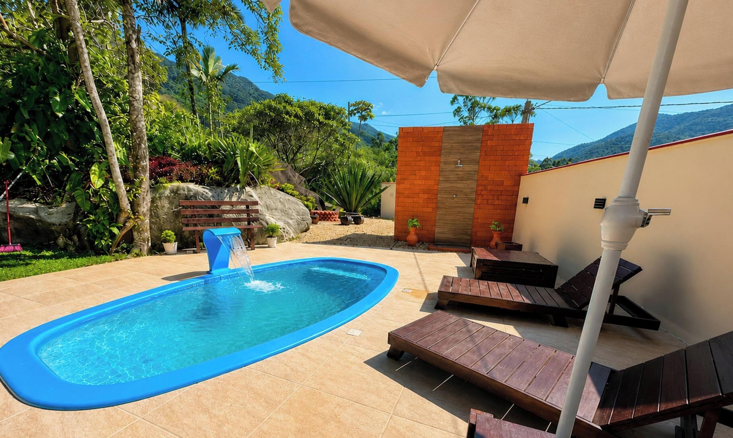 A swimming pool with a blue edge, surrounded by lounge chairs and a pergola with a canopy.