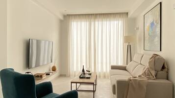 Apartment, 1 Bedroom | Living room | 55-inch Smart TV with digital channels, TV, Netflix