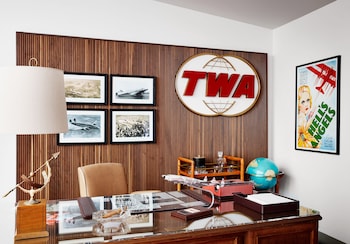 A gym with treadmills, weight benches, and dumbbells. at TWA Hotel at JFK Airport