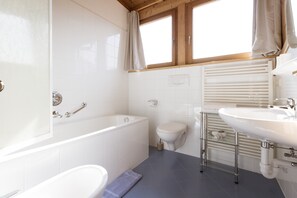 Bathtub, hair dryer, towels