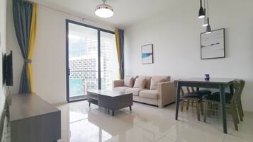 Deluxe Apartment, 3 Bedrooms | Living area | 40-inch LED TV with digital channels, TV