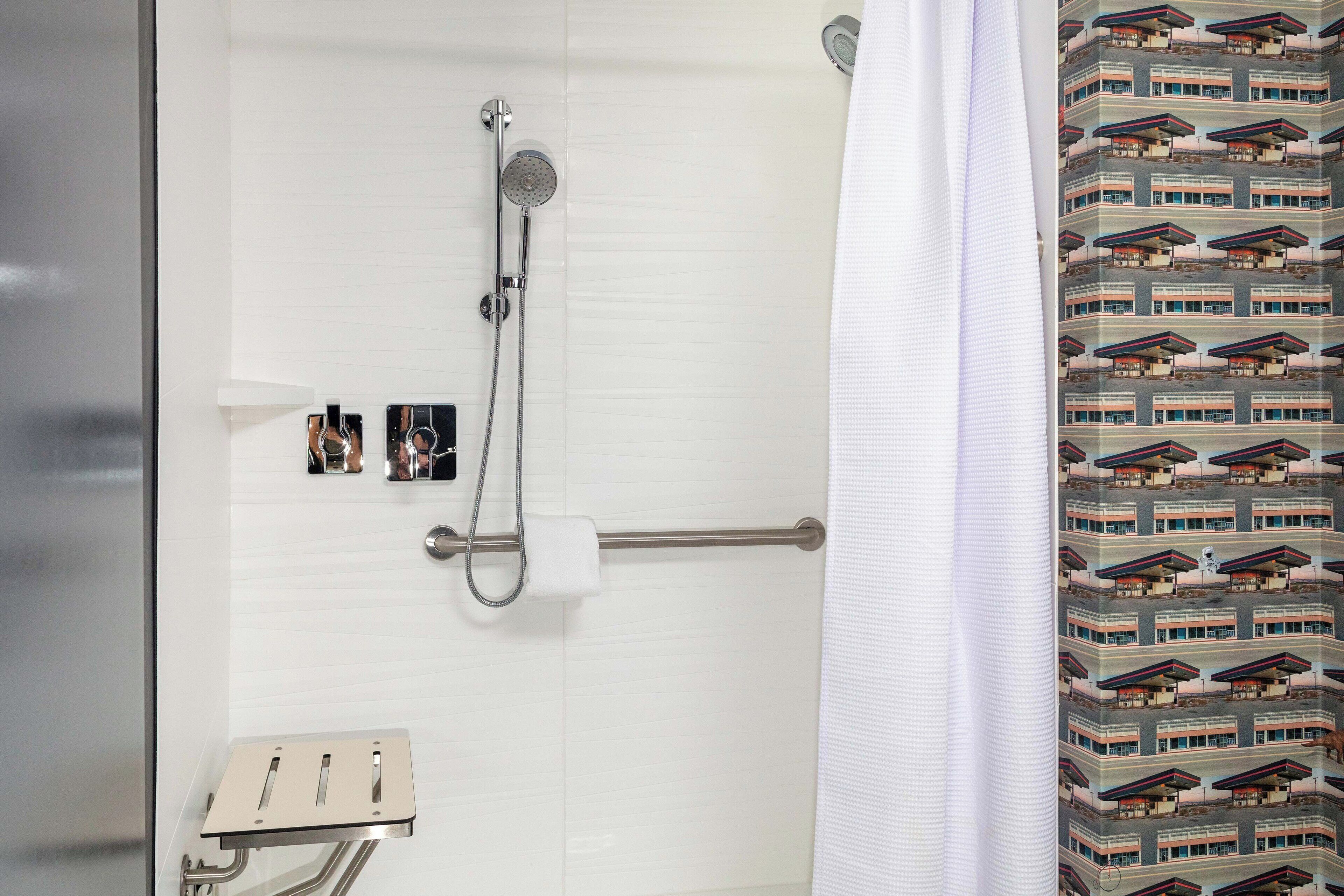 bathtub, hair dryer, towels