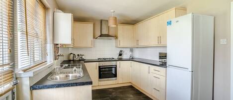 Fridge, microwave, oven, cookware/dishes/utensils