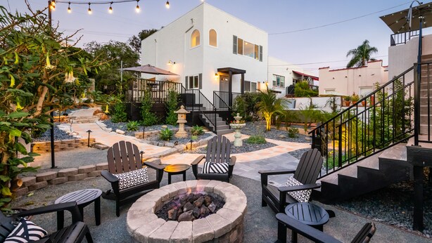 A patio area with outdoor seating, a fire pit, and string lights. - 1stResorts.com 3NEW FAMILY VILLAS/AMAZING WATER VIEWS/AC/3 decks/3hottubs/parkng (San Diego)