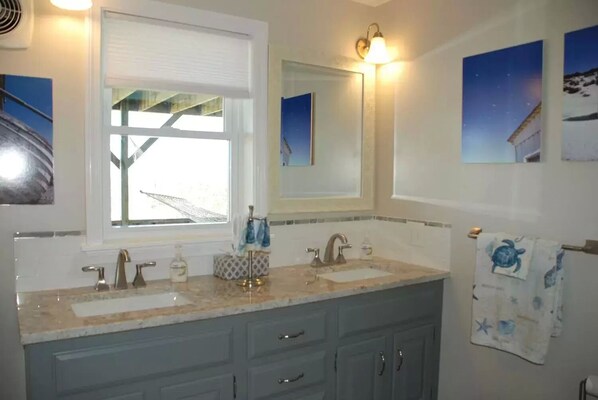 A bathroom with two sinks, a window, and a mirror. - Gorgeous Beach Home Offering PANORAMIC Views Of Cape Cod Bay. (Sandwich)