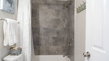 Combined shower/tub, hair dryer, towels, soap