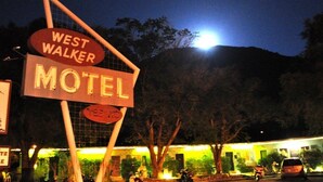A motel sign with "WEST WALKER" and "MOTEL" written on it.