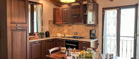 Furniture, Interior Design, Wood, Kitchen, Countertop, Ceiling, Kitchen & Dining Room Table, Flooring, Light Fixture, Cabinetry