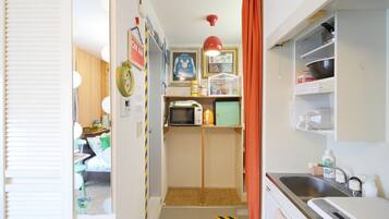 Fridge, microwave, cookware/dishes/utensils