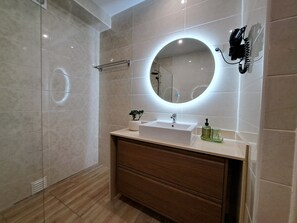 Shower, hair dryer, towels, soap