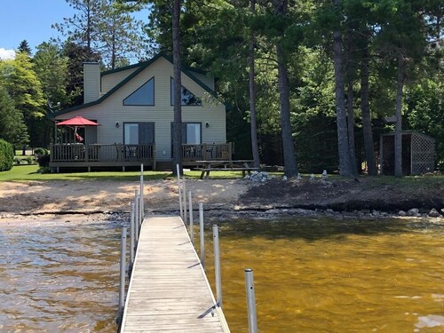 Black Lake sunset waterfront home 78' private sandy beach on prestine Black Lake