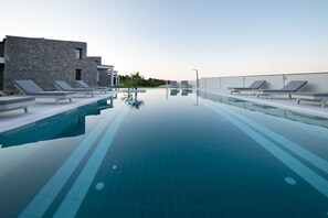 Seasonal outdoor pool, pool umbrellas, sun loungers