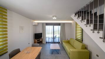 Luxury Suite, Pool Access, Sea View | Living room | 43-inch Smart TV with satellite channels, TV