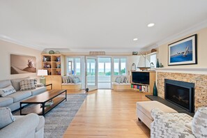 Smart TV, fireplace, books, printers