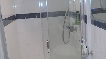 Shower, eco-friendly toiletries, hair dryer, towels