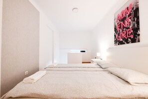 Departamento | 1 habitación, tabla de planchar con plancha, wifi gratis y ropa de cama 