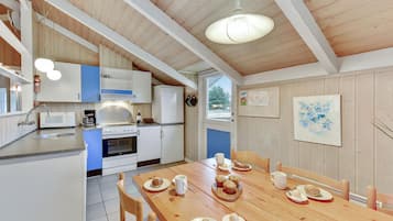 Fridge, stovetop, dishwasher, coffee/tea maker