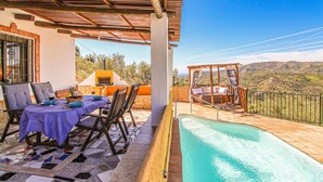 A terrace with a pool, outdoor seating, and a view of the countryside. - Lovely home in Torrox with private swimming pool, can be inside or outside (Torrox)