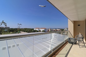 Enjoy the view from this balcony with a clear view of the sky and distant landscape.