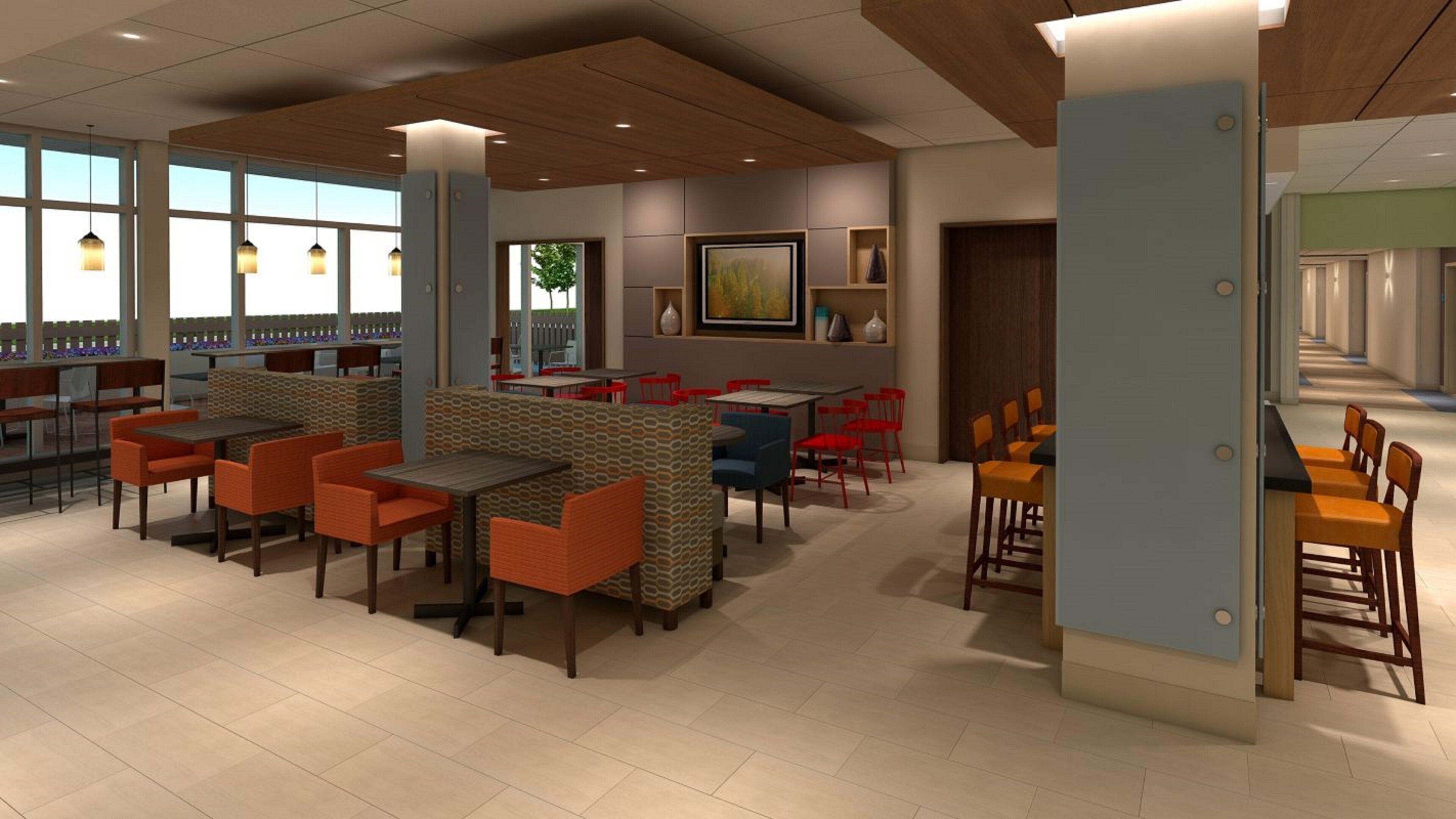 A modern restaurant with high tables and booths, a bar area, and large windows.