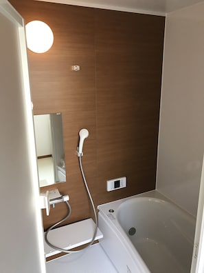 Apartment | Bathroom | Separate tub and shower, free toiletries, hair dryer, slippers