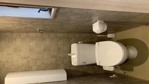 A modern bathroom with a toilet, bidet, and a large mirror. - GH One More Heart Kyoto Station South 6 (Kyoto)
