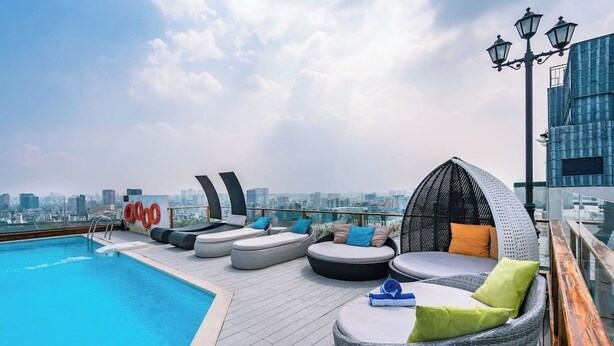 A rooftop pool area with lounge seating and a city view. - Saigon Finest - IDG Suites Collection - 12J (Ho Chi Minh City)