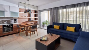 A modern living room with a blue sofa and a coffee table.
