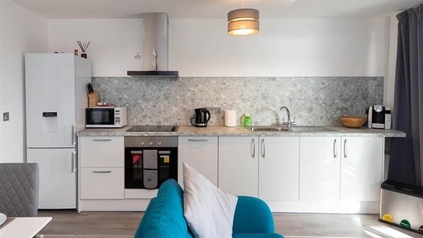 Fridge, microwave, oven, cookware/dishes/utensils