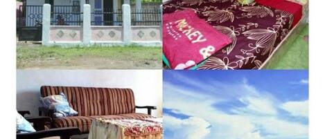 A house with a front porch, a bed with a floral bedspread, a striped sofa, and a beach scene with a pier.