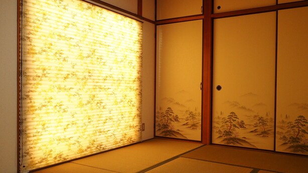 A traditional Japanese room with tatami flooring, sliding doors with landscape paintings, and a window with floral blinds.