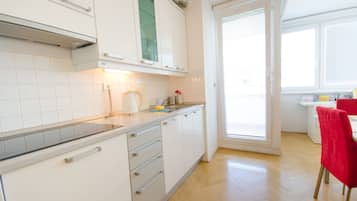 Apartment | Private kitchen | Fridge, stovetop, cookware/dishes/utensils