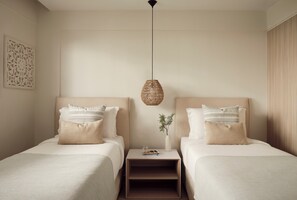 A hotel room with two beds, a bedside table with a lamp, and a decorative wall piece. - Mare Paphos (Kissonerga)
