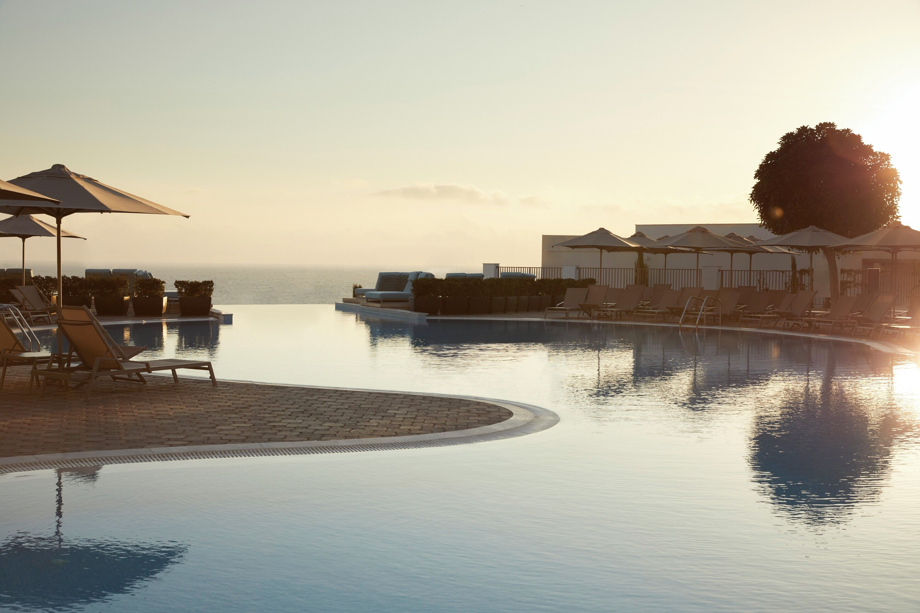 Seasonal outdoor pool, pool umbrellas, pool loungers