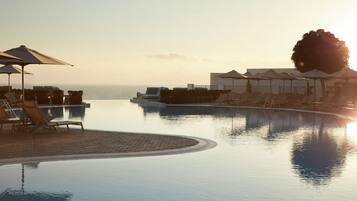 Seasonal outdoor pool, pool umbrellas, pool loungers