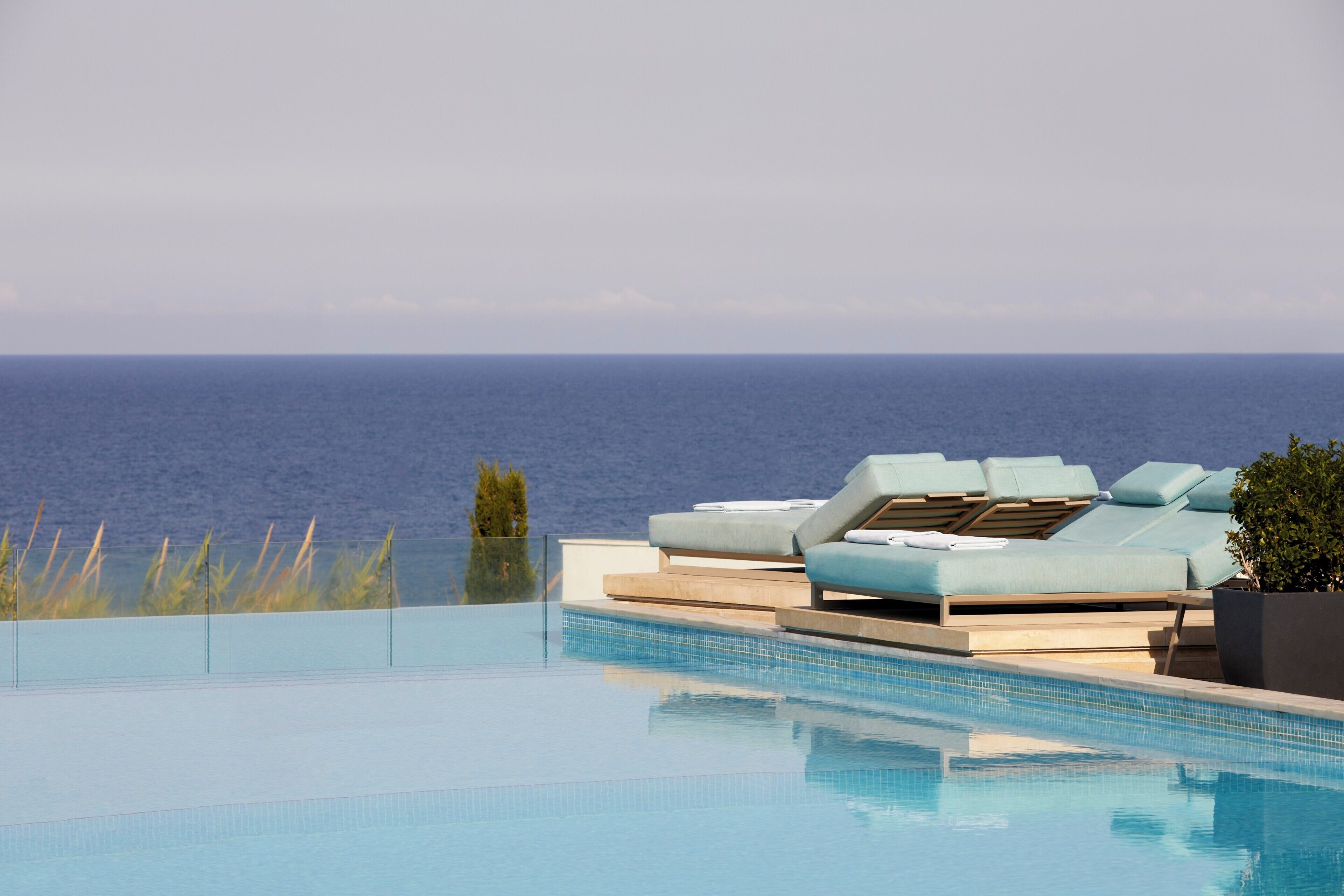 An infinity pool with a clear view of the ocean.