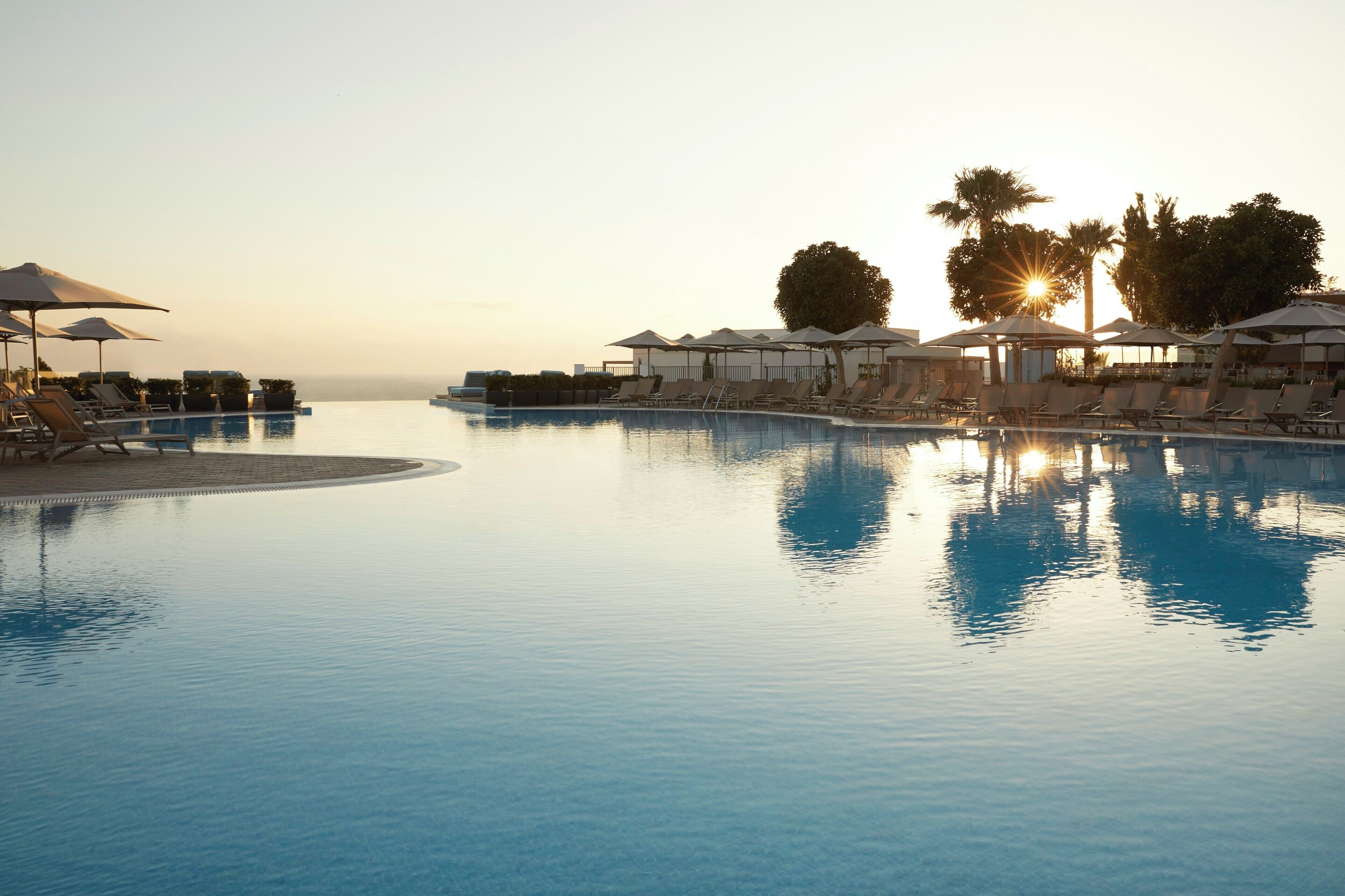 Seasonal outdoor pool, pool umbrellas, sun loungers