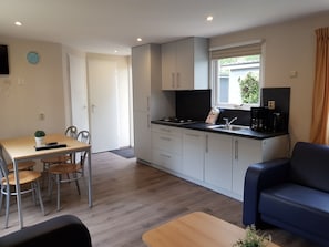 Fridge, stovetop, dishwasher, coffee/tea maker