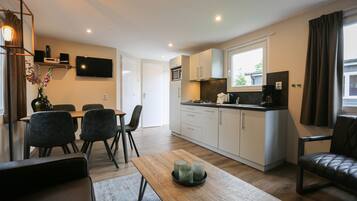 Microwave, stovetop, coffee/tea maker, dining tables