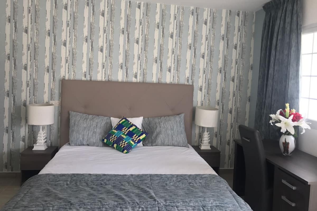 Comfort Room | Individually decorated, desk, laptop workspace, iron/ironing board