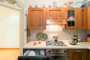 Apartment, 3 Bedrooms | Private kitchen | Full-size fridge, microwave, stovetop, dishwasher