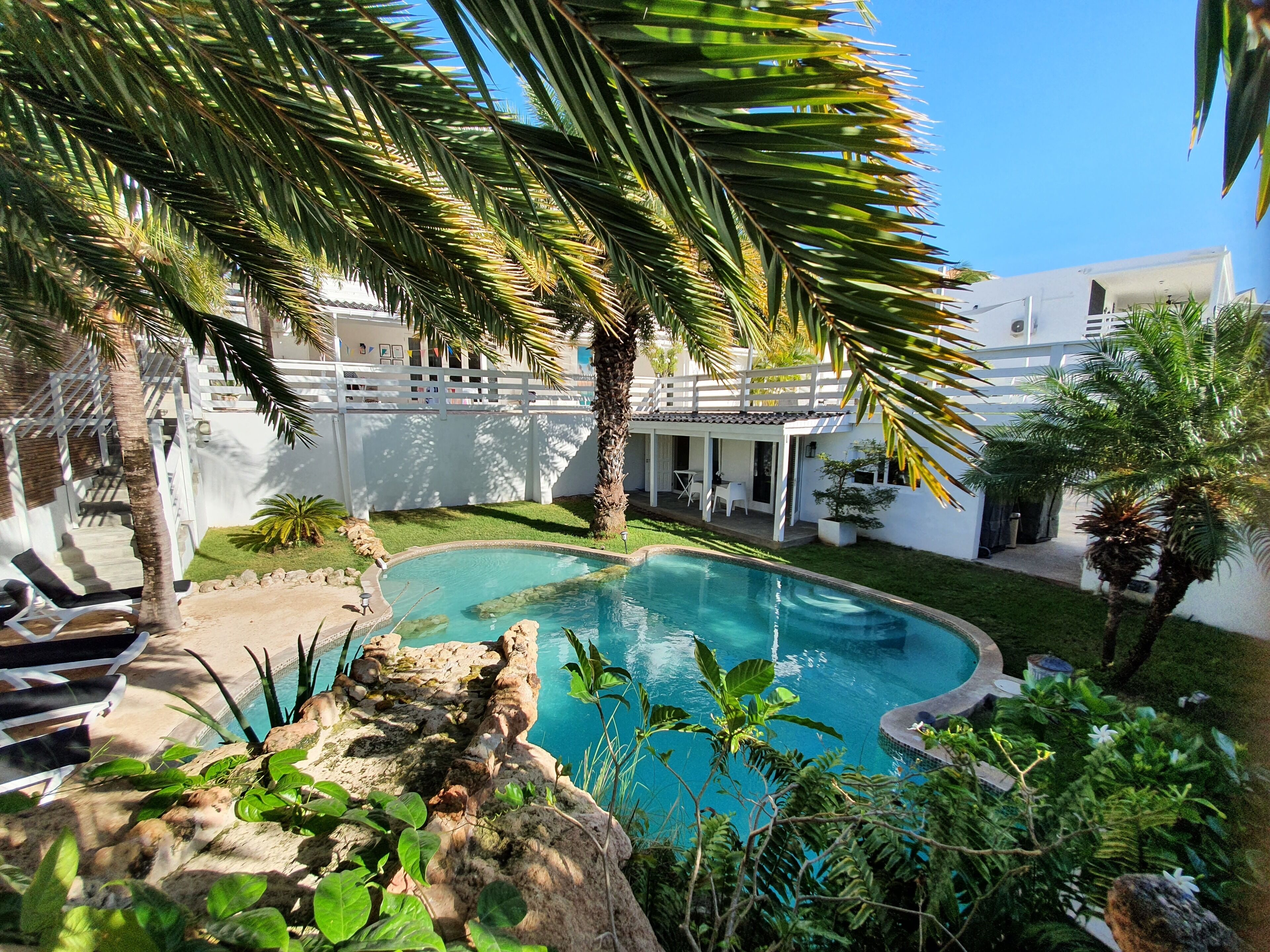 Outdoor pool, open 9:00 AM to 10:00 PM, pool umbrellas, sun loungers