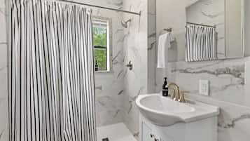 Bathtub, hair dryer, towels